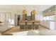 Charming kitchen island with bar stools and pendant lighting, adjacent to the dining and living areas at 9231 Bear Run Ln, Middlesex, NC 27557