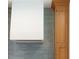 Modern kitchen featuring sleek white range hood, wood cabinets and gray tile backsplash at 9231 Bear Run Ln, Middlesex, NC 27557