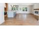 Open concept living room with a modern kitchen island and fireplace at 9231 Bear Run Ln, Middlesex, NC 27557
