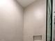 Newly tiled shower with built-in niche and modern fixtures at 9231 Bear Run Ln, Middlesex, NC 27557