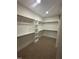Well-organized walk-in closet with shelves and hanging rods for ample storage at 9231 Bear Run Ln, Middlesex, NC 27557