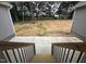 View of backyard from a patio featuring stairs and a treed background at 9235 Bear Run Ln, Middlesex, NC 27557