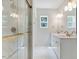 Luxurious bathroom with double vanity, marble tiled shower, and modern fixtures at 9235 Bear Run Ln, Middlesex, NC 27557