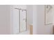 Modern bathroom featuring a glass enclosed shower with gold hardware and white marble tiling at 9235 Bear Run Ln, Middlesex, NC 27557
