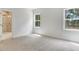 Bright bedroom with plush carpet flooring and a view to a marble-tiled bathroom at 9235 Bear Run Ln, Middlesex, NC 27557