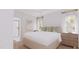 Rendering of a neutral bedroom with a large bed, two windows and a bathroom with shower at 9235 Bear Run Ln, Middlesex, NC 27557