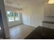 Dining area with a large window, elegant lighting, and views of the outdoors at 9235 Bear Run Ln, Middlesex, NC 27557