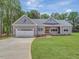Home featuring a large front yard and driveway at 9235 Bear Run Ln, Middlesex, NC 27557