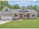 Charming single-story home featuring a manicured front lawn and attached garage at 9235 Bear Run Ln, Middlesex, NC 27557
