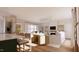 Rendering of a living room featuring white sofas, a fireplace and a view of the kitchen at 9235 Bear Run Ln, Middlesex, NC 27557