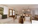 Rendering of an open-concept living room with a view of the dining room, kitchen and outdoor scenery at 9235 Bear Run Ln, Middlesex, NC 27557