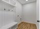 Mudroom boasts a white bench and coat hooks at 9235 Bear Run Ln, Middlesex, NC 27557
