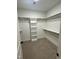 Spacious walk-in closet with built-in shelving and ample storage space, ready for organization at 9235 Bear Run Ln, Middlesex, NC 27557