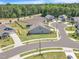 Aerial view of a suburban neighborhood with well-maintained lawns, and sidewalks at 1 Parker Pond Ct, Durham, NC 27703