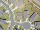 Planned neighborhood with manicured lawns, sidewalks, and symmetrical landscaping at 1 Parker Pond Ct, Durham, NC 27703