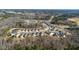 Aerial photograph of a well-designed community of single-Gathering homes in a wooded area at 1 Parker Pond Ct, Durham, NC 27703