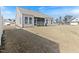 View of back of house with a large yard and screened in porch at 1 Parker Pond Ct, Durham, NC 27703