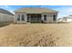 Back of home with screened in porch and large backyard at 1 Parker Pond Ct, Durham, NC 27703