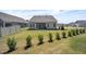 Well-maintained backyard with lawn, landscaping, and home's rear facade at 1 Parker Pond Ct, Durham, NC 27703