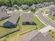 This aerial view showcases a meticulously landscaped backyard and neighboring homes at 1 Parker Pond Ct, Durham, NC 27703
