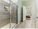 The primary bathroom has a tiled shower and seamless access to the primary bedroom at 1 Parker Pond Ct, Durham, NC 27703