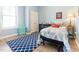 Cozy bedroom featuring a patterned rug and decor in cool color palette at 1 Parker Pond Ct, Durham, NC 27703