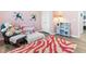 Cozy bedroom with pink walls, playful decor, and a closet at 1 Parker Pond Ct, Durham, NC 27703