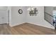A cozy dining room featuring hardwood floors, a chandelier, and a picture gallery on a painted white wall at 1 Parker Pond Ct, Durham, NC 27703