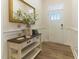 Welcoming entryway with stylish console table, decorative mirror, and attractive front door at 1 Parker Pond Ct, Durham, NC 27703