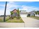 Inviting home with a two-car garage, attractive landscaping, and a well-maintained lawn at 1 Parker Pond Ct, Durham, NC 27703