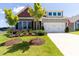 Beautiful single-Gathering home with a manicured lawn and attached two-car garage at 1 Parker Pond Ct, Durham, NC 27703