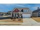 Charming single-Gathering home with gray siding, brick accents, and a well-maintained front yard with landscaping at 1 Parker Pond Ct, Durham, NC 27703
