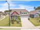 Charming home with a stone and red accent facade, complemented by a well-manicured lawn and two-car garage at 1 Parker Pond Ct, Durham, NC 27703
