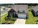 Charming single-Gathering home with a well-maintained lawn and two-car garage at 1 Parker Pond Ct, Durham, NC 27703
