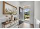Inviting foyer with light walls, a decorative table, and an open doorway showing the outside at 1 Parker Pond Ct, Durham, NC 27703