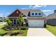 Charming home with a two-car garage and well-manicured lawn and colorful flowerbeds at 1 Parker Pond Ct, Durham, NC 27703