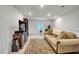 Cozy living room features plush sofa, TV, and decorative rug in a well-lit space at 1 Parker Pond Ct, Durham, NC 27703
