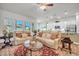 Open-concept living room with hardwood floors, a ceiling fan, modern lighting and comfortable seating at 1 Parker Pond Ct, Durham, NC 27703