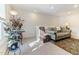 Cozy living area with comfortable seating, rug, and ample natural light at 1 Parker Pond Ct, Durham, NC 27703