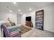 Loft area with comfortable seating, entertainment center, and a bookshelf at 1 Parker Pond Ct, Durham, NC 27703