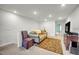Loft area with comfortable seating, carpet floors, and access to the rest of the house at 1 Parker Pond Ct, Durham, NC 27703