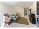 Cozy loft space with comfortable seating, a TV, and bookshelves at 1 Parker Pond Ct, Durham, NC 27703