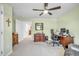 Spacious home office with desk, chair, and ample storage in a well-lit room at 1 Parker Pond Ct, Durham, NC 27703