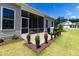 Relaxing screened porch with a paver patio, outdoor seating, and a grill at 1 Parker Pond Ct, Durham, NC 27703