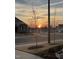 Street showcasing landscaped yards and homes in a quiet neighborhood at sunset at 1 Parker Pond Ct, Durham, NC 27703