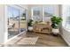 Sunroom with lots of natural light and view to outside through sliding glass door and windows at 1 Parker Pond Ct, Durham, NC 27703