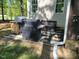 Backyard with an outdoor kitchen area equipped with grills and a patio for entertaining or relaxing at 10 Holden Ct, Youngsville, NC 27596