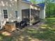 The backyard features a patio and a screened-in porch, perfect for outdoor entertaining and relaxation at 10 Holden Ct, Youngsville, NC 27596