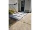 Basement entry with stone pavers and storm door offers easy access and curb appeal at 10 Holden Ct, Youngsville, NC 27596