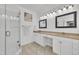Bright bathroom featuring double sinks, stylish mirrors, granite countertops, and a glass door shower at 10 Holden Ct, Youngsville, NC 27596